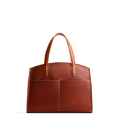 Nutmeg*Medium | Leather tote bag with handles, adjustable crossbody strap, zipper top, and two back pockets