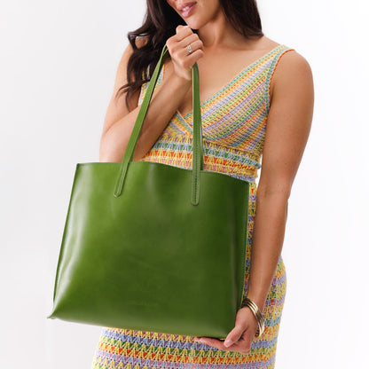 Green Apple*Large | Model holding leather tote bag with interior snap key loop