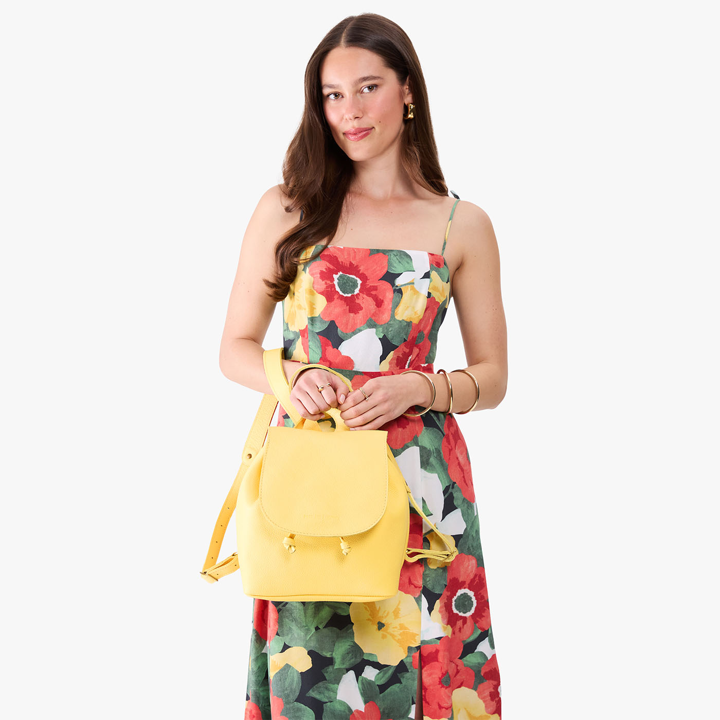 Butter Bliss | Pebbled leather drawstring backpack being worn by a person