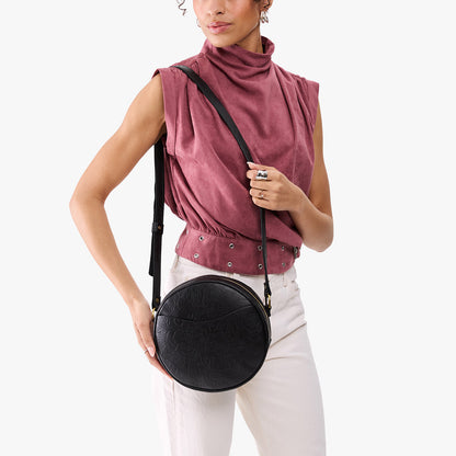 Dahlia*Large | Model wearing circle shaped crossbody bag with top zipper