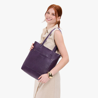 Empire*Classic | Model holding medium Tote with dual shoulder straps and crossbody strap