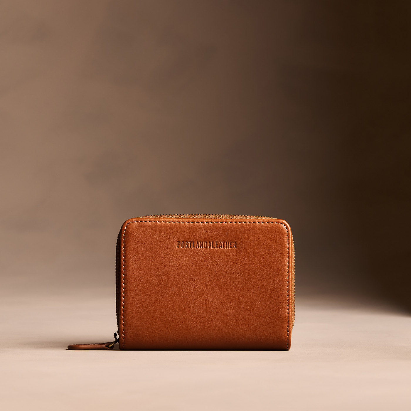 Vintage Tan | Wallet with card and storage pockets on a light brown background