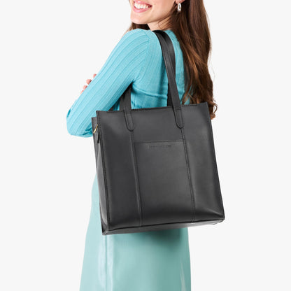 Black*North/South | Structured large tote bag with overlapping panels and crossbody strap