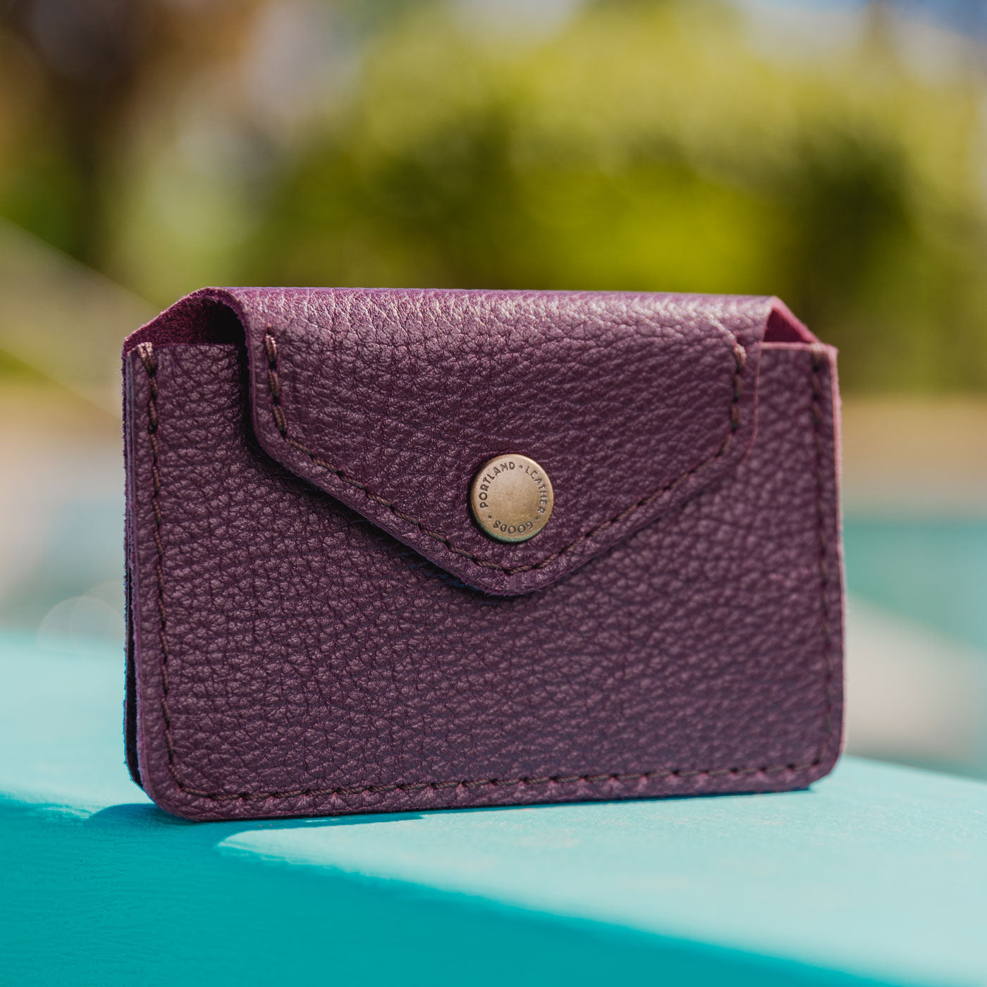 Plum | | Small leather wallet with snap closure