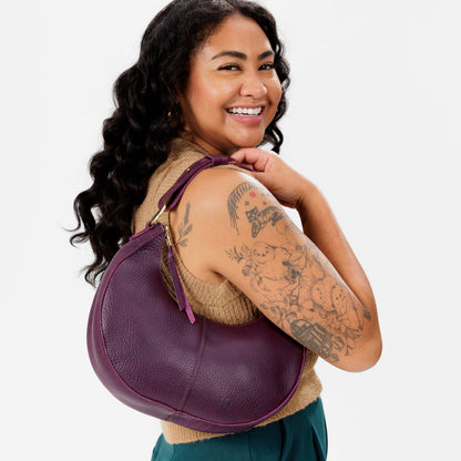 Plum*Small | Crescent shaped shoulder bag with zipper closure and adjustable strap