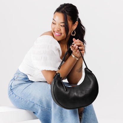 Pebbled--black*Small | Crescent shaped shoulder bag with zipper closure and adjustable strap