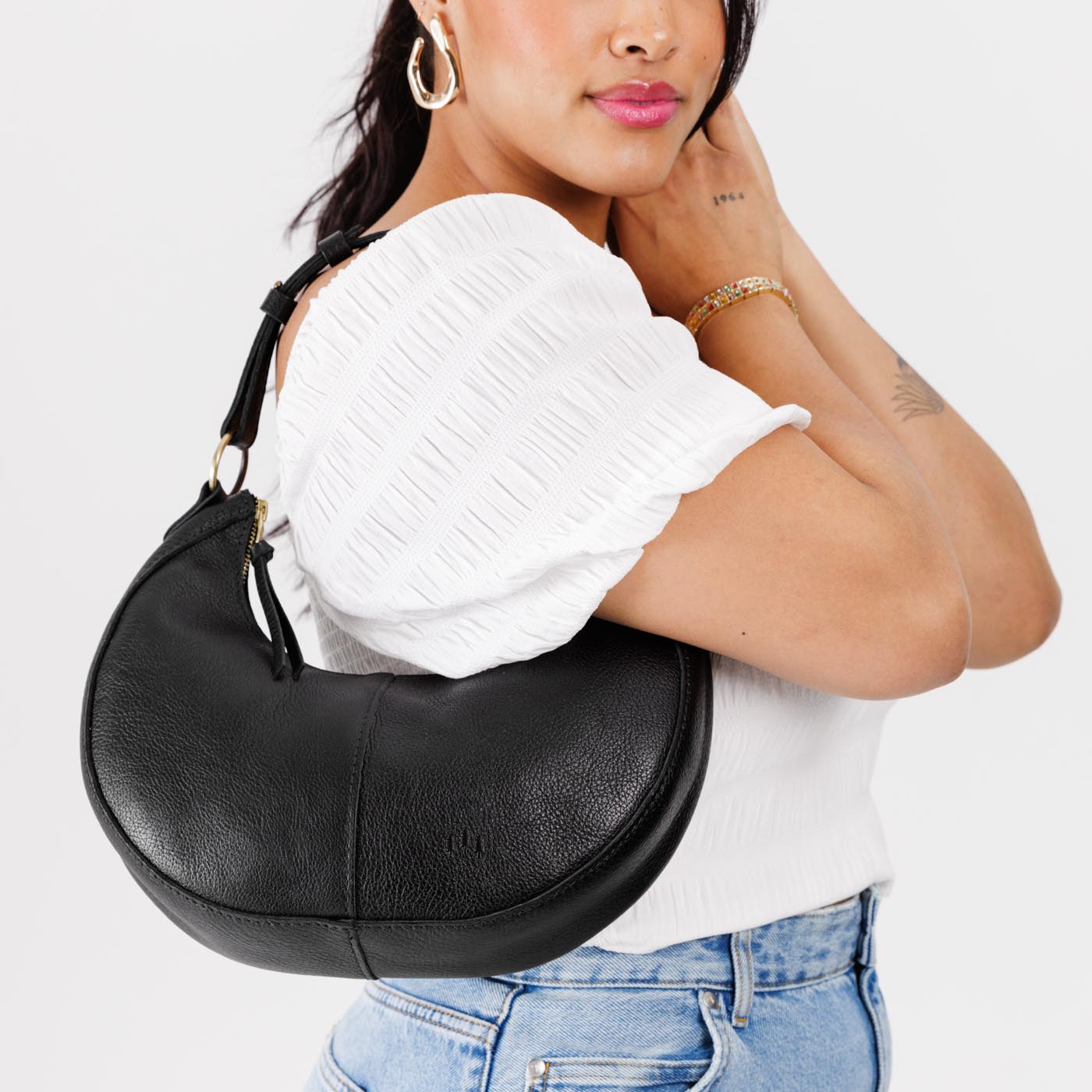 Pebbled--black*Small | Crescent shaped shoulder bag with zipper closure and adjustable strap