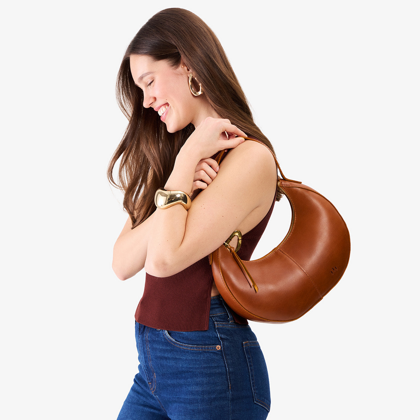 Honey*Small | Crescent shaped shoulder bag with zipper closure and adjustable strap