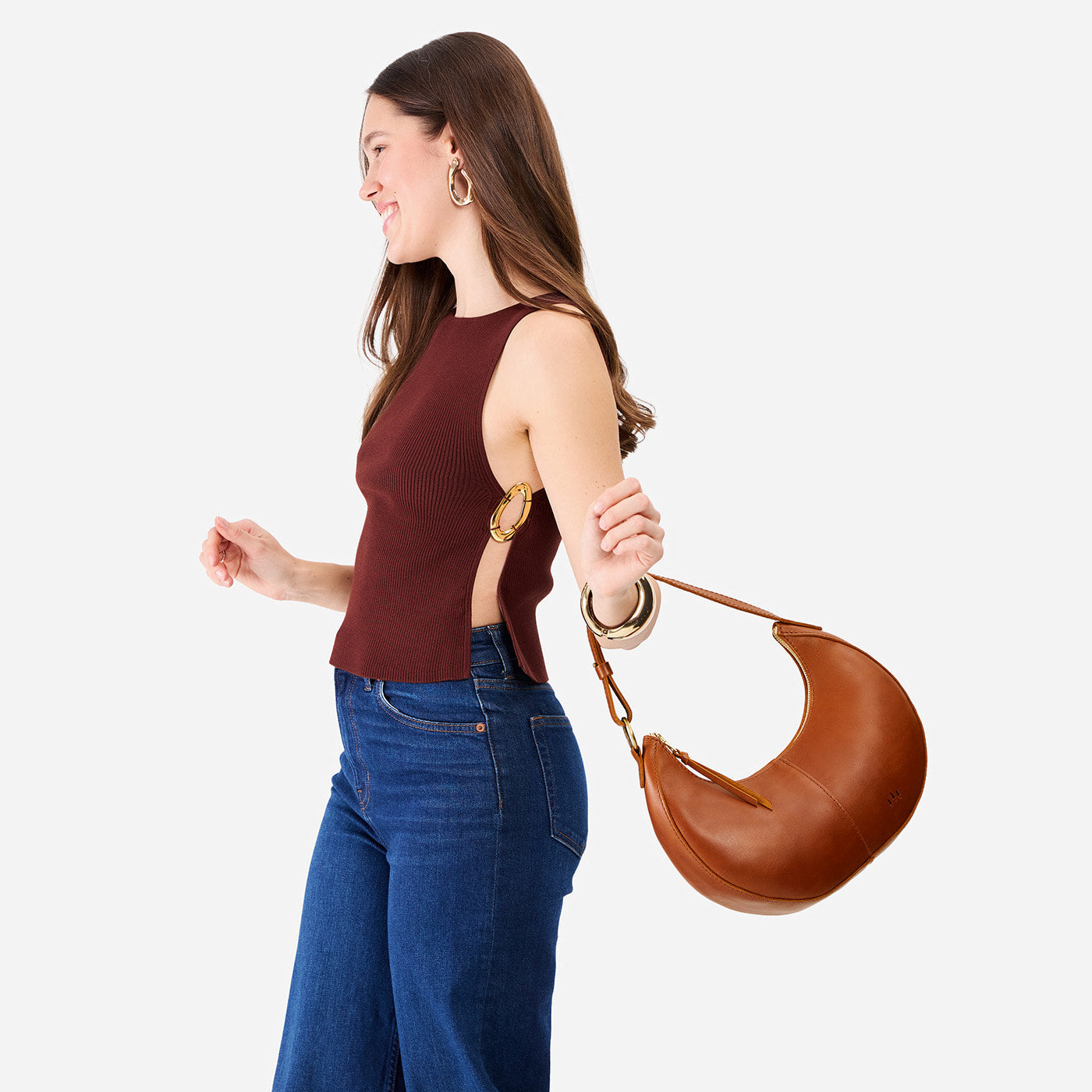 Honey*Small | Crescent shaped shoulder bag with zipper closure and adjustable strap