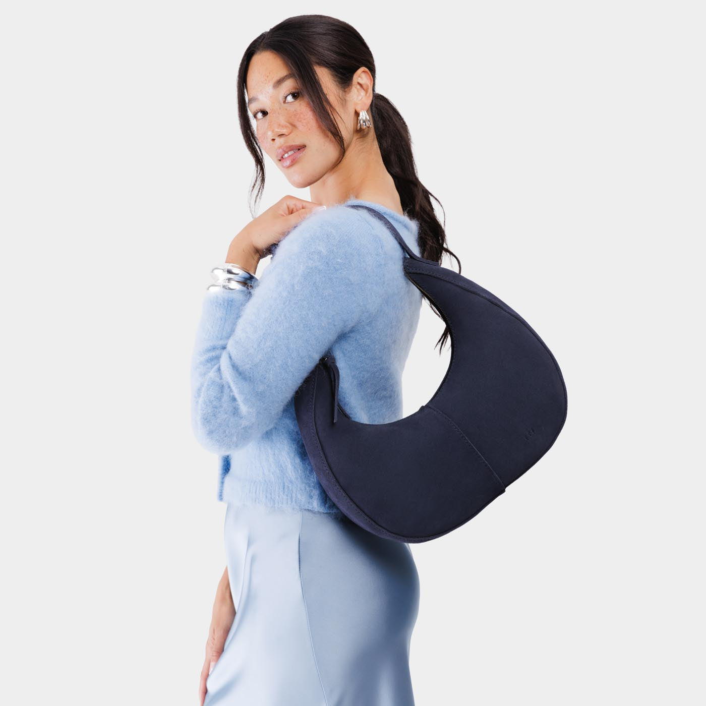 Alaska Blue*Large | Crescent shaped shoulder bag with zipper closure and adjustable strap