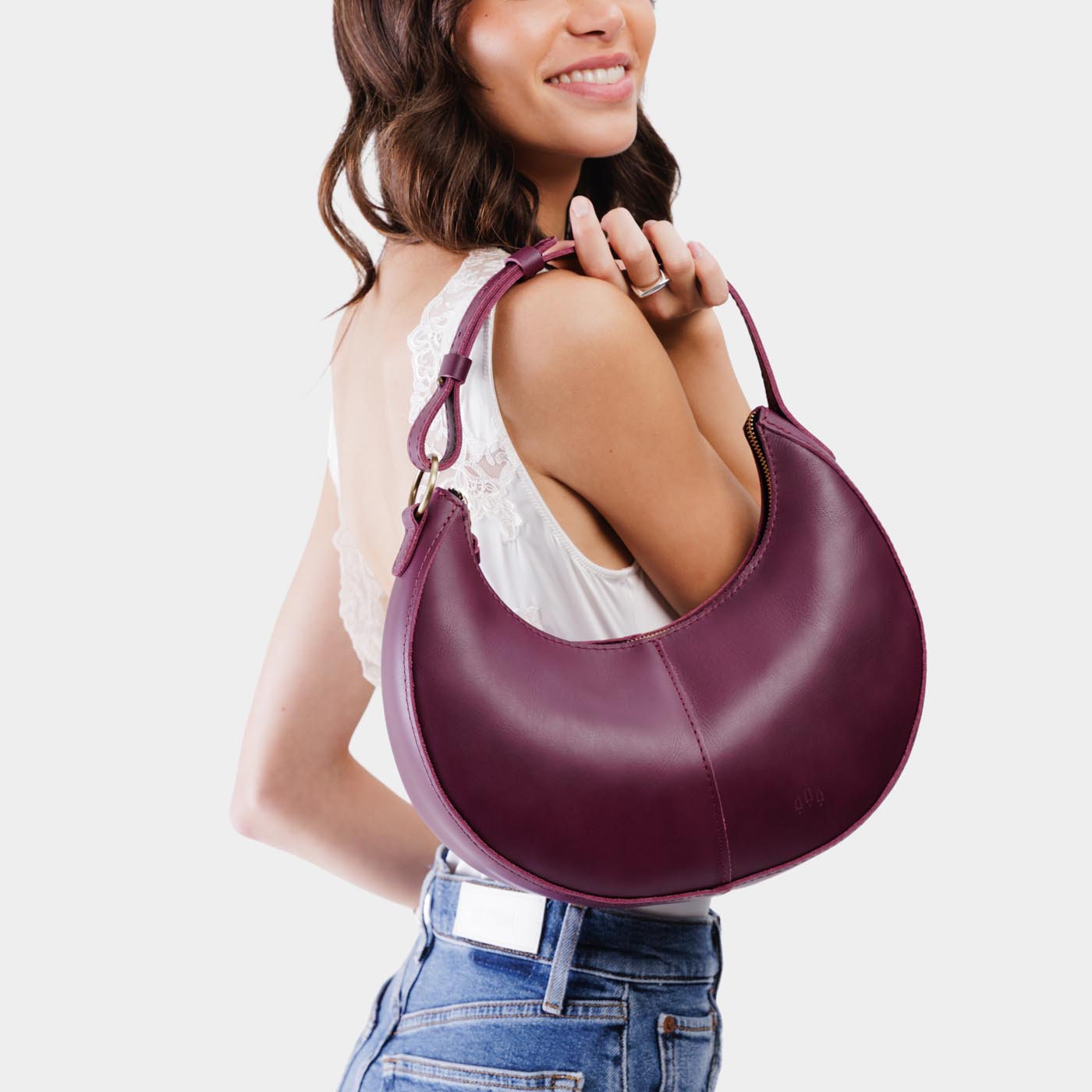 Lollipop*Small | Crescent shaped shoulder bag with zipper closure and adjustable strap