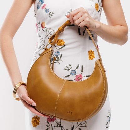 Mango*Small | Crescent shaped shoulder bag with zipper closure and adjustable strap