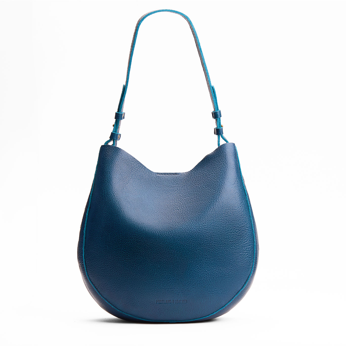 Caspian*Large | Rounded shoulder bag with adjustable strap on a white background
