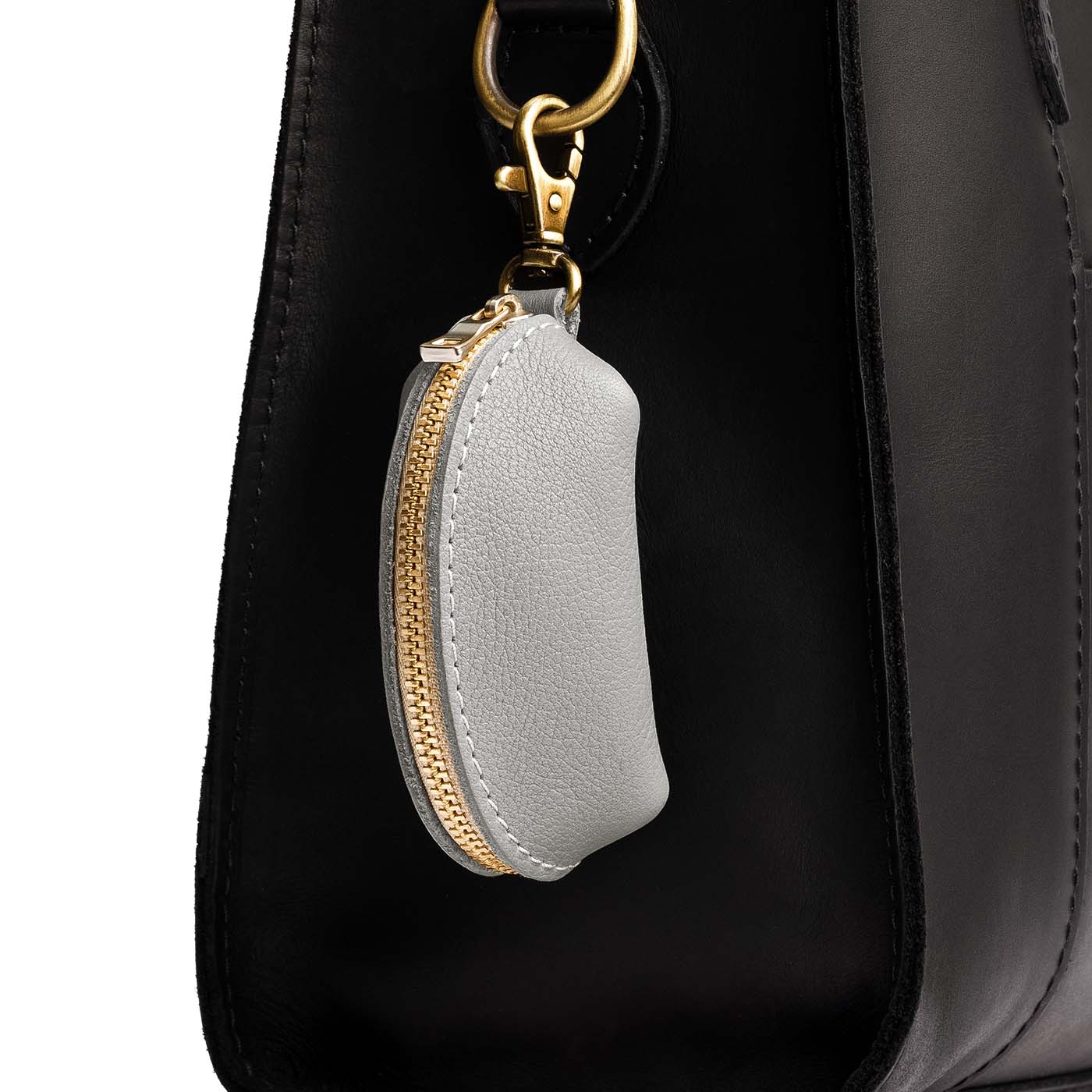 Nimbus | Taco shaped leather pouch with zipper and swivel lobster clasp on bag