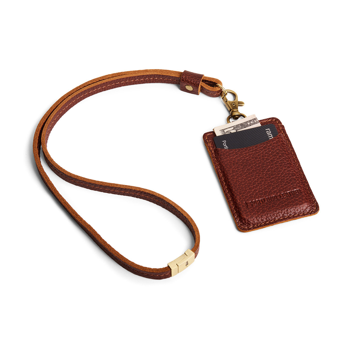 Nutmeg | A leather lanyard attached to a matching card holder on a white background